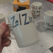 Load and play video in Gallery viewer, Ze / Zir / Zirs - WRAPPED UP PRONOUN MUG
